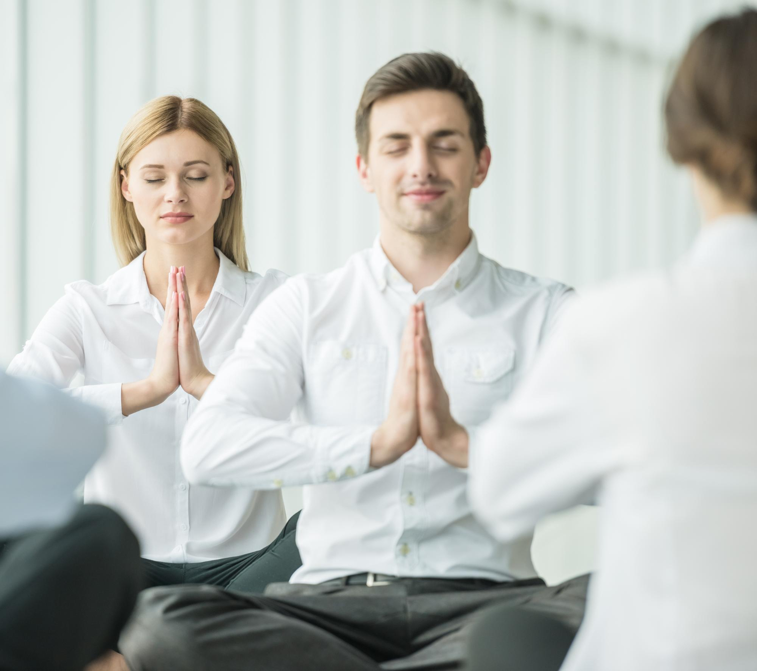 New York professionals practicing a calming technique to manage work stress