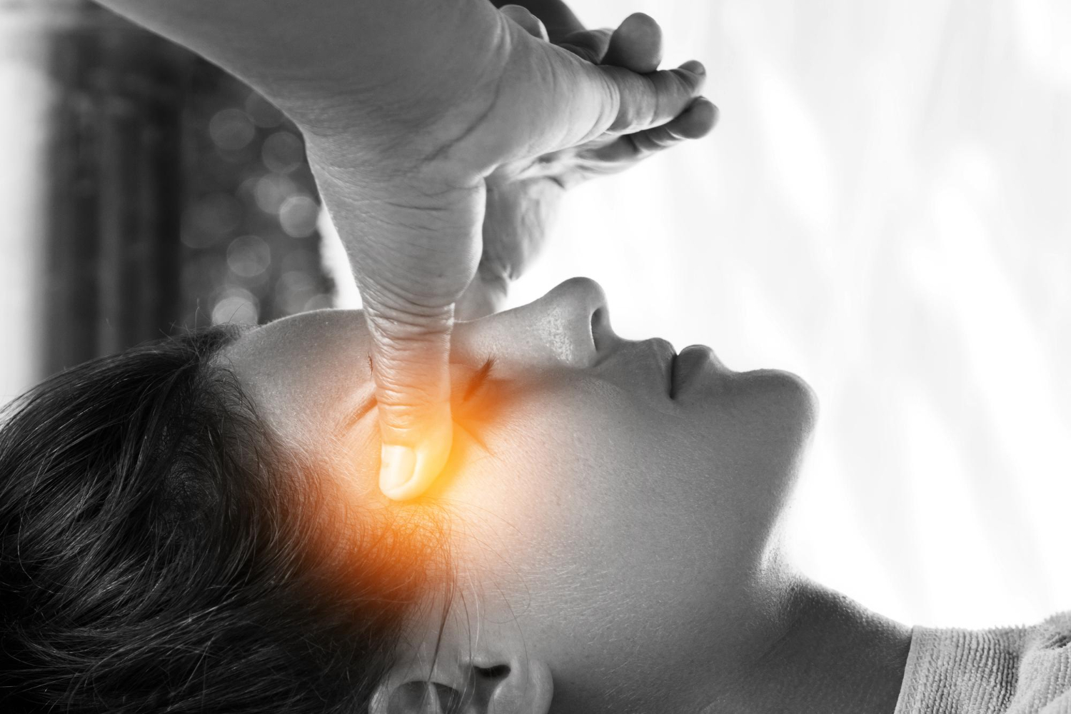 Hypnotherapist using a pendulum during a calming NYC session