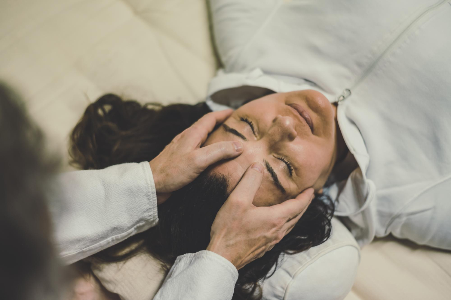 Clients relaxing during a group hypnotherapy session in NYC