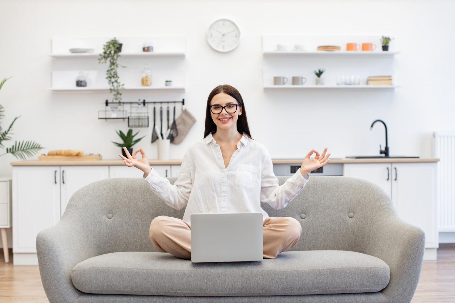 Woman attending an online clinical hypnotherapy session from home