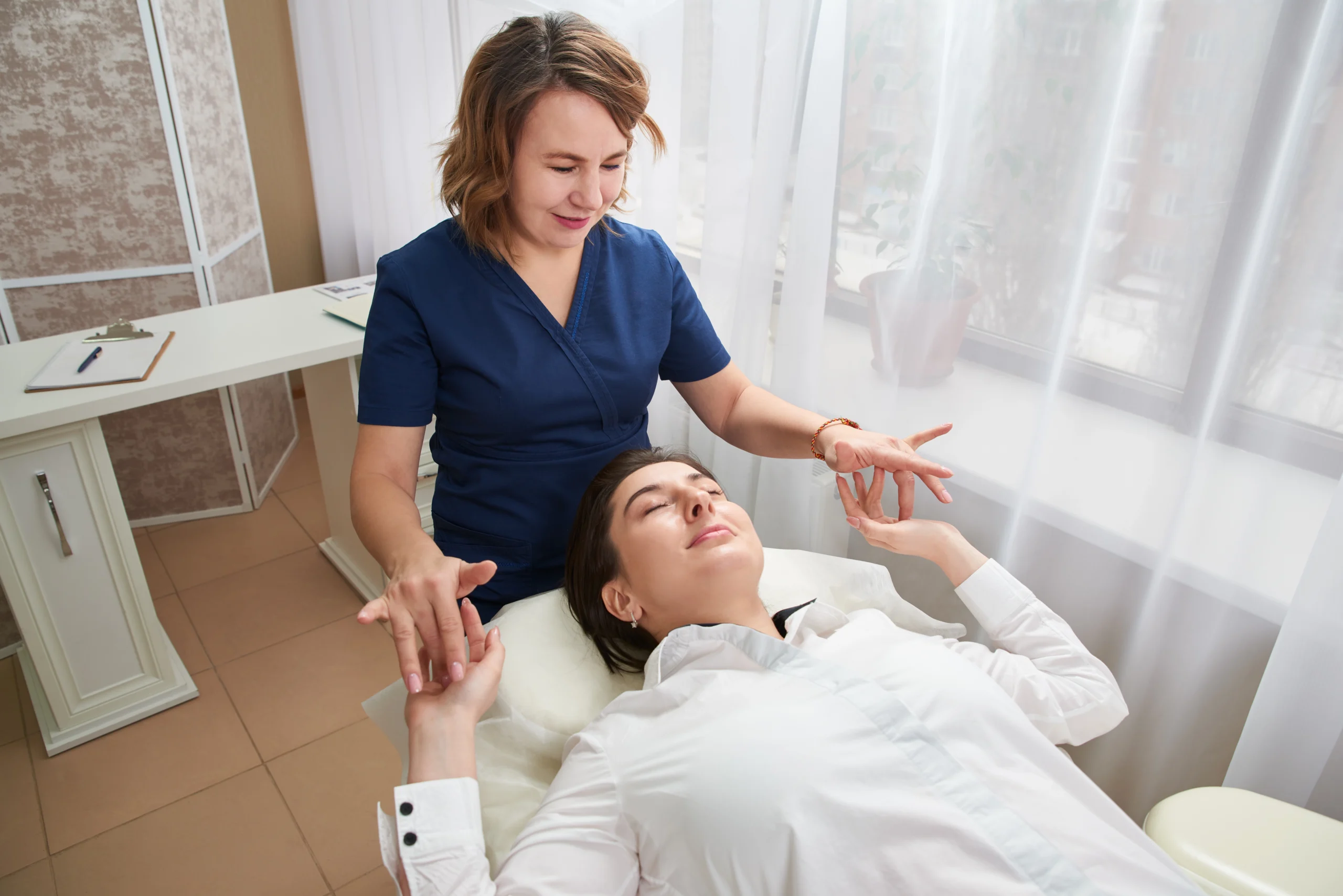 Clinical hypnotherapist guiding a client during a relaxation session